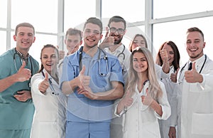 Close up. young medical professionals showing thumbs up