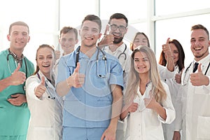 close up. young medical professionals showing thumbs up