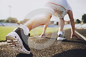 Close up. Young Sporty Man Ready to Run Sprint.