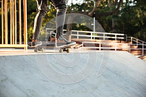 Close up of a young teenage skateboarder in action