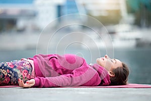 Close up of a young woman in Dead Body pose