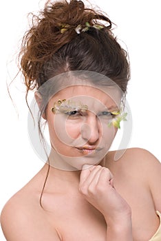 Close up young woman with feather make up