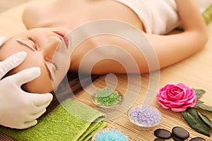 Close-up of a young woman getting spa treatment at beauty salon. spa face massage. facial beauty treatment. spa salon.