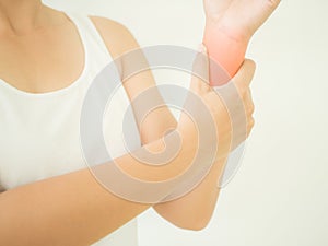 Close up young woman holding her wrist symptomatic Office Syndrome