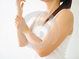 Close up young woman holding her wrist symptomatic Office Syndrome