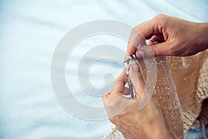 Close-up Young woman knits