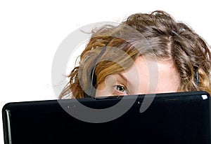 Close up of young woman with laptop and headphones