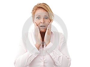 Close-up of a young woman looking surprised against white background