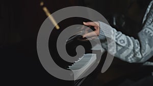 Close-up of young woman opening piano. Media. Woman begins to play piano beautifully. Woman plays piano beautifully with