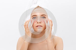 Close-up of a young woman with patches under eyes from wrinkles and dark circles. Isolated on white background