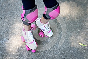 Close up of young woman with roller skating.