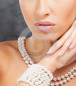 Close-up of a young woman's face in jewelry