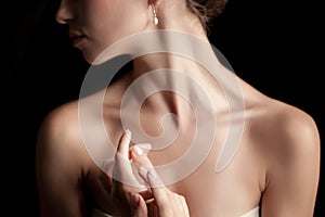 The close-up of a young woman's neck