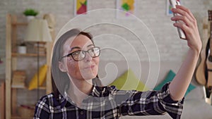 Close up young woman with a scar from a burn on her face takes a selfie