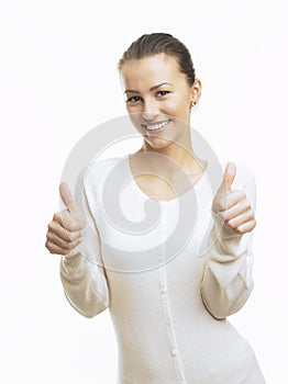 Close-up of a young woman showing thumbs up