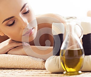 Close-up of young woman in spa. Traditional healing therapy and massaging treatments.