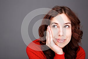 Close up young woman thinking and glancing away