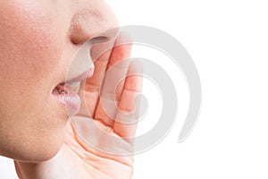 Close up of young women whispering photo