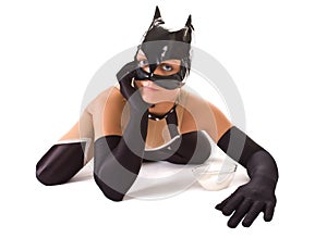 Close-up of ypung girl in cat mask (isolated on wh photo