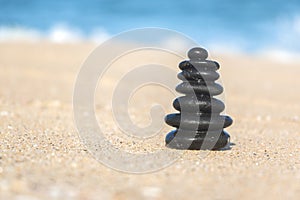 Close-up of Zen Stacked Pebbles on Sandy Beach