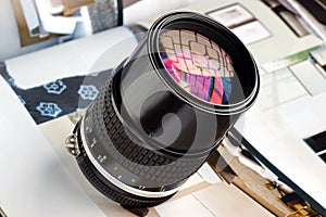 Close-up zoom lens with light reflected from window bars.