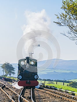 Close view of approaching steam engine `Blanche` at Woody Bay station