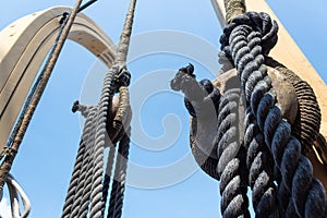 Close view of block and tackle, rope rigging on an old ship