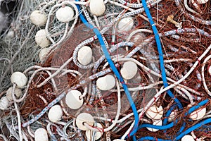 Close view of blue ropes, floats and fishnets
