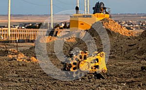 Close view of compaction wheel excavator attachment in the construction site