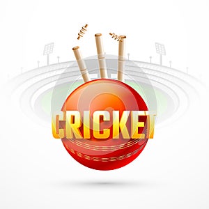 Close view of cricket ball with wicket stumps on stadium view background.