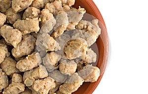 Close view of crumbled Italian sausage in a small bowl