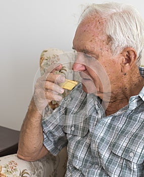 Close View of Elderly Gentleman Eating a Fruit Mince Pie.