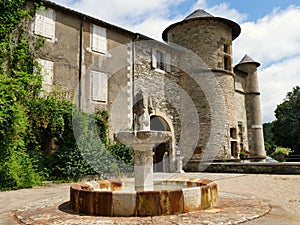 The fountain on the square in front of the ChÃ¢teau de Lacaze photo