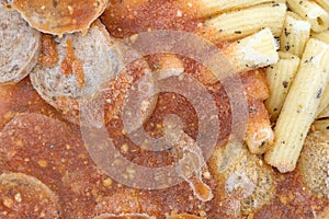 Close view of frozen rigatoni pasta with meatballs and sausage