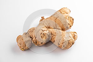 Close view on a ginger root on white background