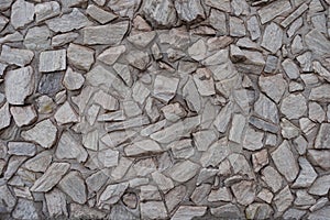 Close view of gray gravel pebble dash