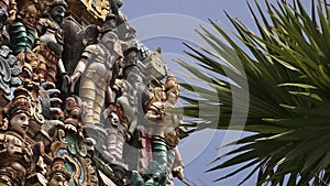 A close view of a group of Indian statues depicting various Gods