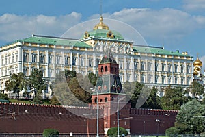 Close view of Kremlin wall with tower and Cathedral photo made from opposite bank of the river Moscow photo