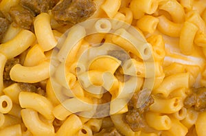 Close view of mac and cheese with hamburger chunks