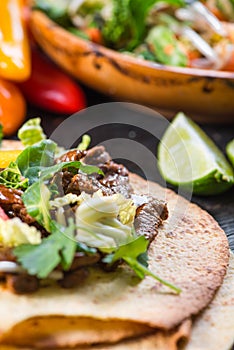 Close view on mexina tacos with beef and vegetables