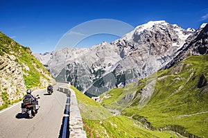 Close view on motorbike on the famous road in mountains Alps Passo Stelvio. Favourite place for all bike riders