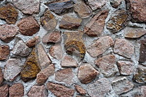 Close view of multicolored gravel pebble dash on the wall