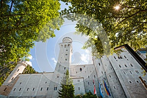 Close view of Neuschwanstein castle with trees