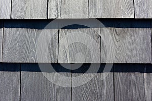 Close view of newer grayed cedar shingles in rows