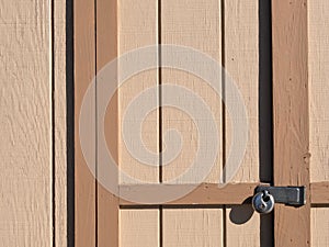 Close view of a padlocked shed door
