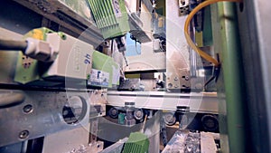 A close view on a PVC profile-processing machine with several heads.