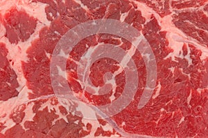 Close view of a raw beef loin boneless end cut strip steak