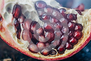 Close view of red pomegranate fruit seeds