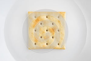 Close view of saltine cracker on a plate