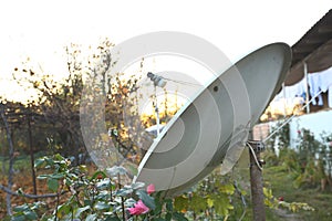 Close view of satellite dish. Telecommunications round antenna. Urban connection receiver. TV connection signal. City radio